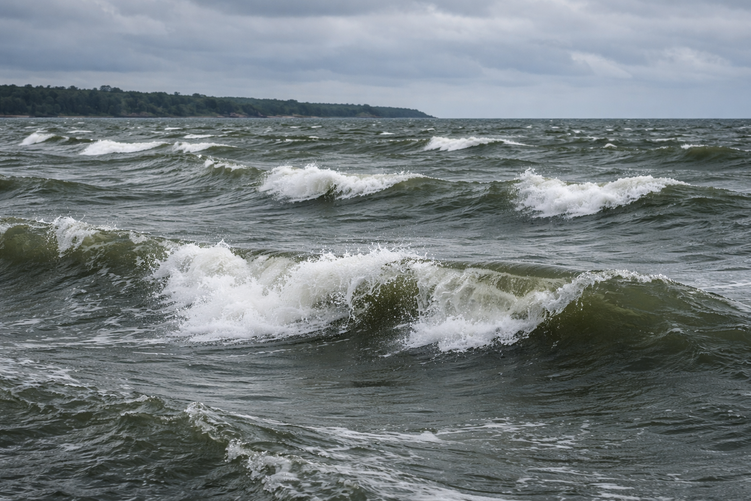 Dark choppy Great Lakes water under a moody Ontario sky